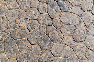 Texture of stone paving stones in the form of an ornament.