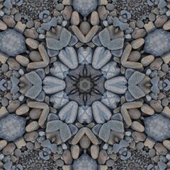 kaleidoscopic style of pebbles on a beach with colourful child's play fork and rake