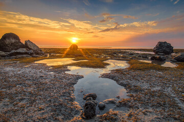 The sun reflects its rays on the 