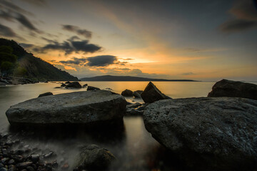 Twilight on Likwatang beach with big stones