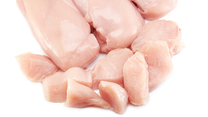 Fresh raw chicken breast fillet whole and sliced isolated closeup on white background, clipping path