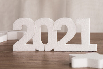 White 2021 new year number on wooden background