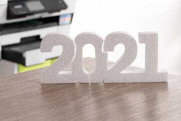 White 2021 new year number on wooden background
