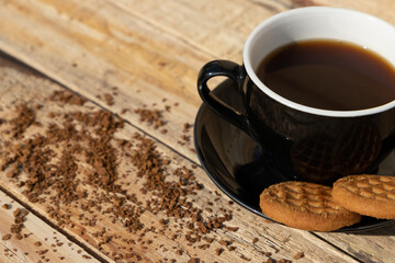 close up morning instant coffee with two biscuit cookies on a wooden table