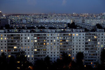 Light in the houses of the sleeping area at night. Moscow, Russia.