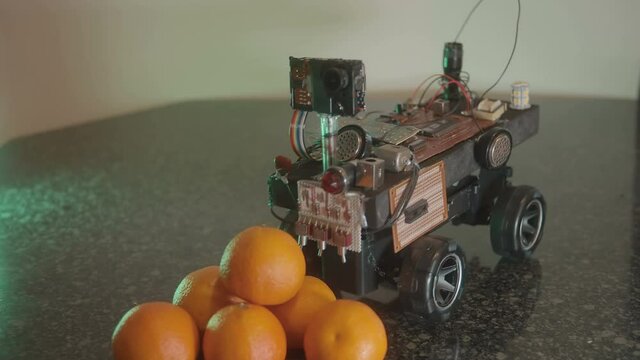 robot looking at fruit