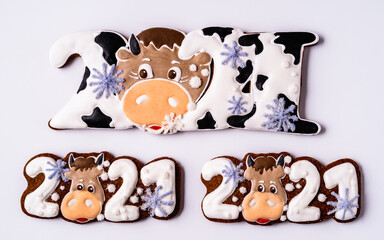 Christmas gingerbread in the shape of bull on white background.
