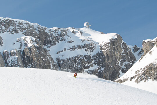 skiing in front of iconic austrian mountain