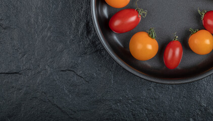 Close up photo of fresh cherry tomatoes inside of pan