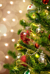 Balls on the tree. Bokeh garlands in the background. New year concept.