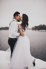 groom and bride wedding love couple in winter in snow