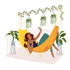 afro young woman taking a selfie in a hammock