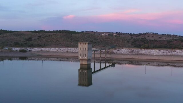 Drone aerial view of a dam lake reservoir landscape in Terena, Portugal