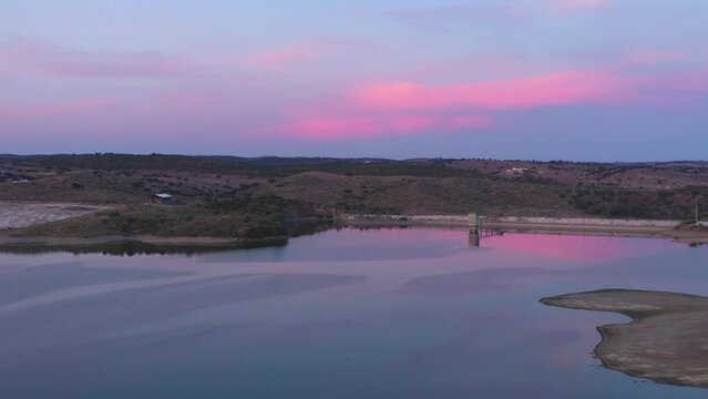 Drone aerial view of a dam lake reservoir landscape in Terena, Portugal