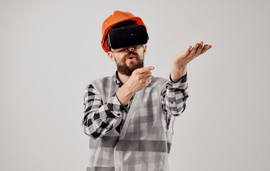 Male architect in orange paint from 3D glasses virtual reality civil engineer