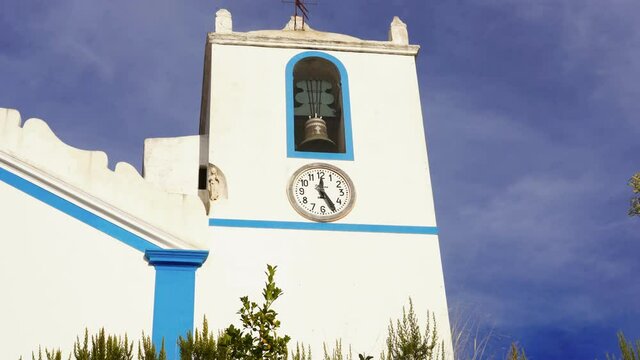 White church of the village of Terena with clock and tower in Alentejo, Portugal