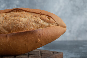 Closeup photo of white bread on wooden board