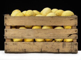 lemons inside vintage wooden box
