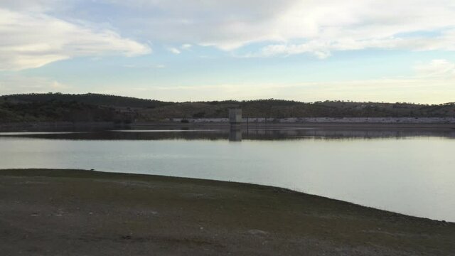Drone aerial view of a dam lake reservoir landscape in Terena, Portugal