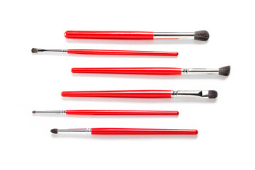 red makeup brushes on white, 6 makeup brushes