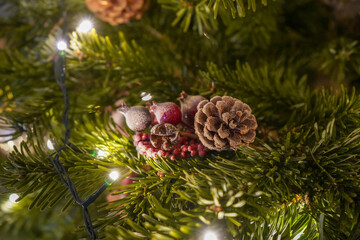 Small Christmas tree ornament in a real Christmas tree 