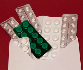 Pharmaceutical medicine and supplement with capsules and tablets in package. Medical treatment that helps activity, support for health and immune system. Receiving an Internet order in an envelope
