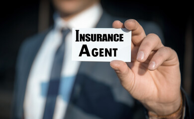 Businessman holding card of insurance agent