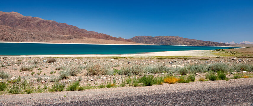 Orto Tokoy Reservoir in Kyrgyzstan with blue sky and azul water