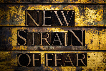 New Strain of Fear on grunge textured copper and gold background