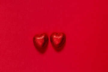 two red hearts on wooden background, close-up, Valentine's day