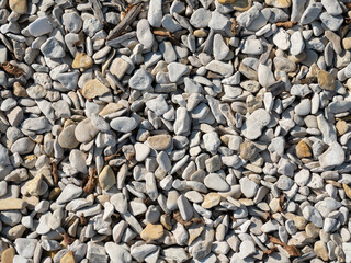 Abstract texture, grey pebbles on the ground
