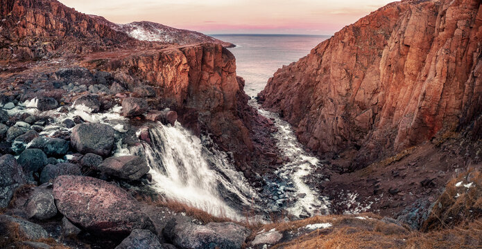 Waterfall in Teriberka in autumn. Tundra colorful landscape at Kola Peninsula in the autumn.Teriberka village at Murmansk Region in Northern Russia