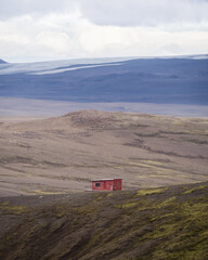 Little red house in front of Asgardur, Jökulkrokur and Hofsjökull. Hveradalir, Iceland