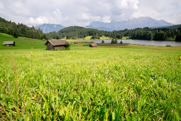 hut on meadows by Geroldsee lake, Bavarian Alps, Germany