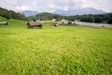 hut on meadows by Geroldsee lake, Bavarian Alps, Germany