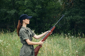 Military woman Holding a gun in hand is a lifestyle fresh air 