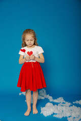 Little cute girl with fidget on Valentine's Day
