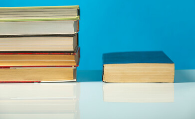 Closed book on the table. Copy space.