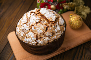 Panettone holiday cake on a wooden background

