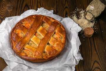 Meat pie on a brown wooden table
