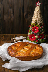 Meat pie on a brown wooden table
