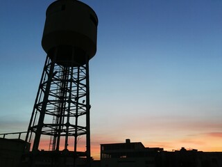 water tower at sunset