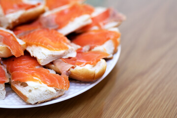 Sandwiches with butter and salmon on the festive table