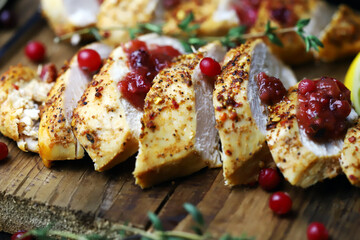Selective focus. Turkey fillet with cranberry sauce.