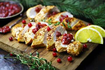 Selective focus. Turkey fillet with cranberry sauce.