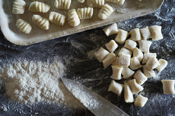 Italian gnocchi on the marble table, traditional kitchen.