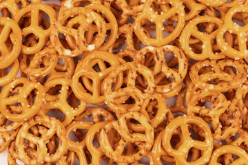 Densely sprinkled crackers with salt on a flat surface