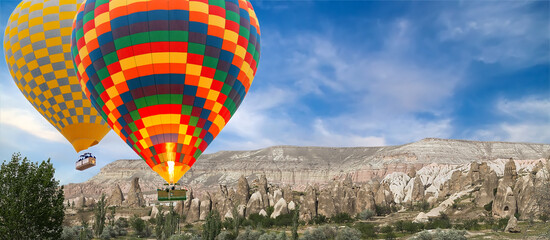 Colorful hot air balloons flying over valley mountains Goreme Open Air Museum, Turkey © Emoji Smileys People