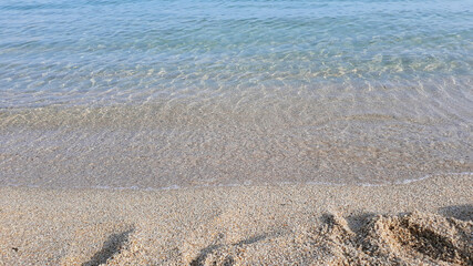 Soft beautiful ocean wave on sandy beach. Background