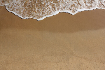 brown Sand beach and Wave foam.